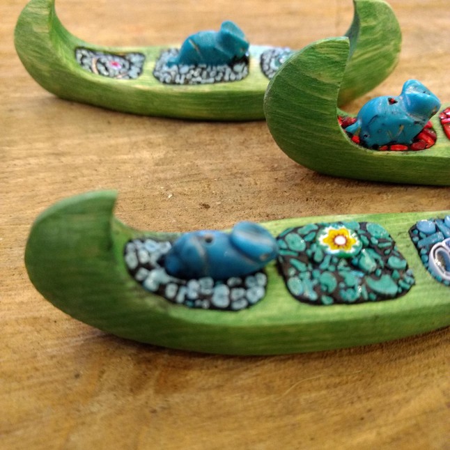 Photo of Tiny hand-carved canoes