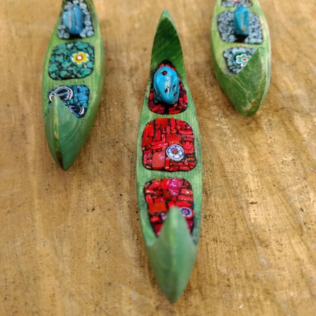 Photo of Tiny hand-carved canoes