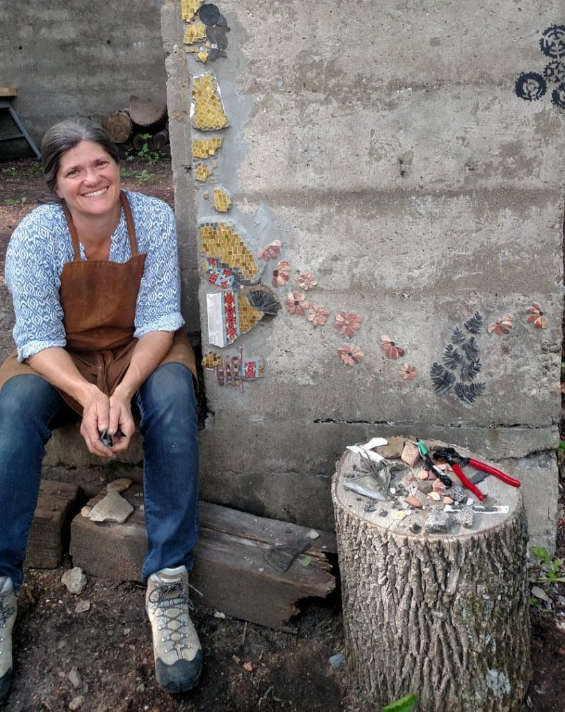 Lynn Donihe making her garden out of red dog