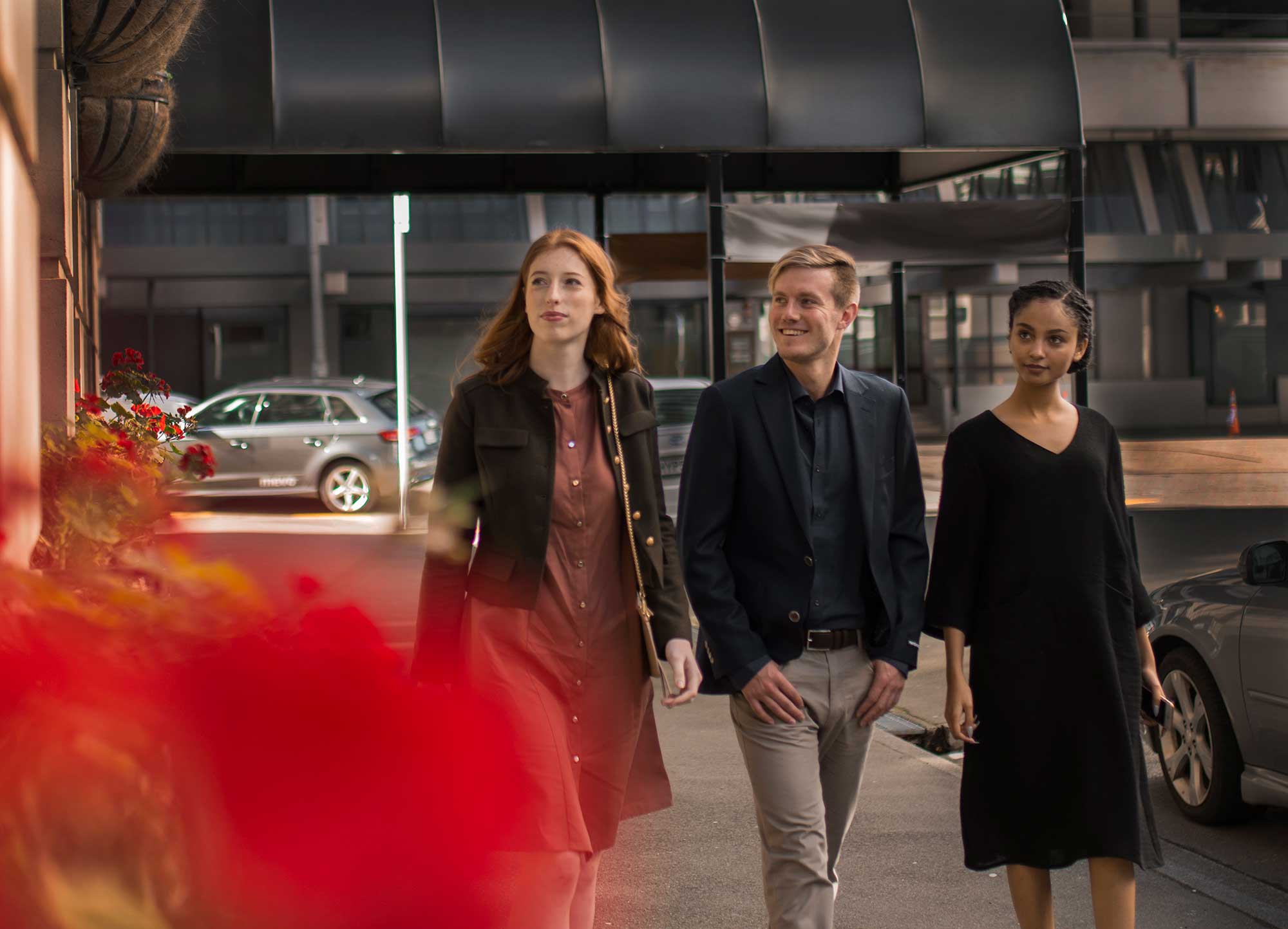 People on a city street with a Mevo Audi A3 e-tron in the background